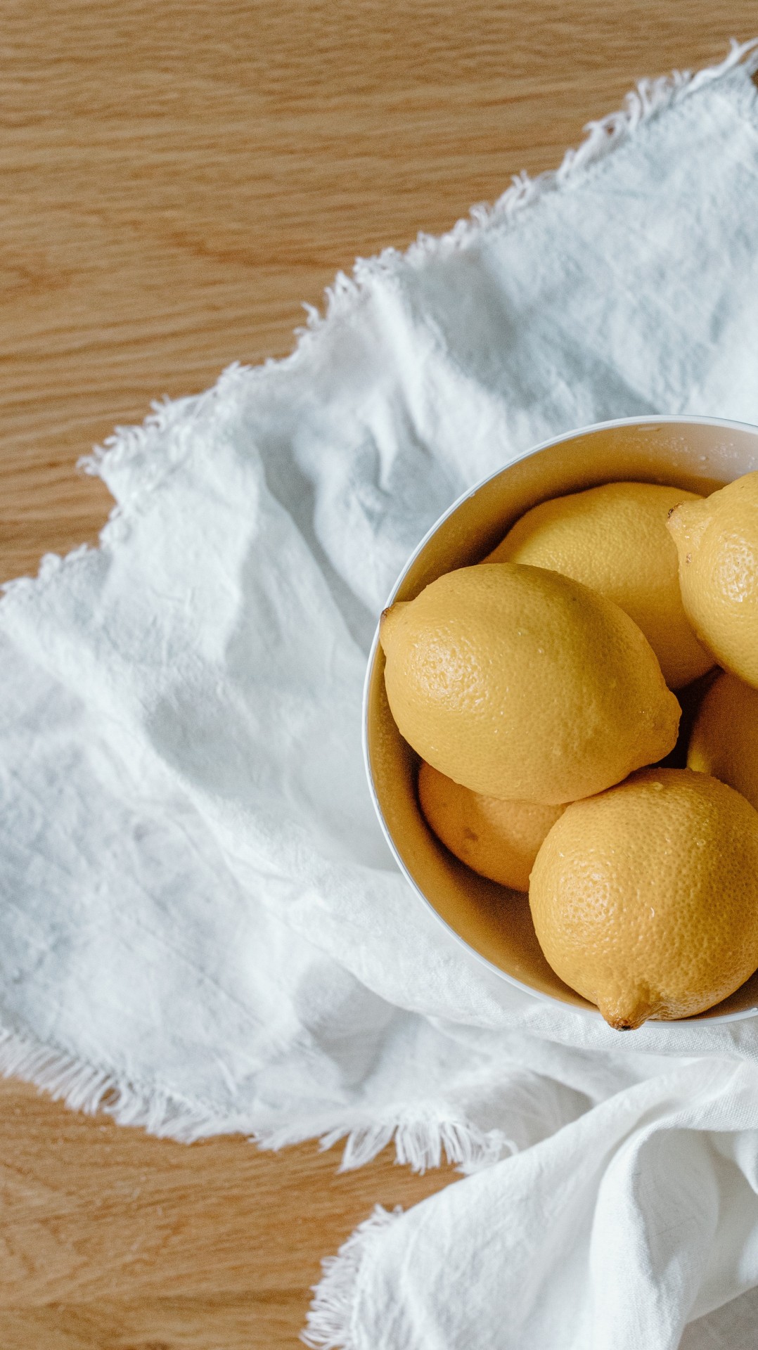 Lemons in bowl on table